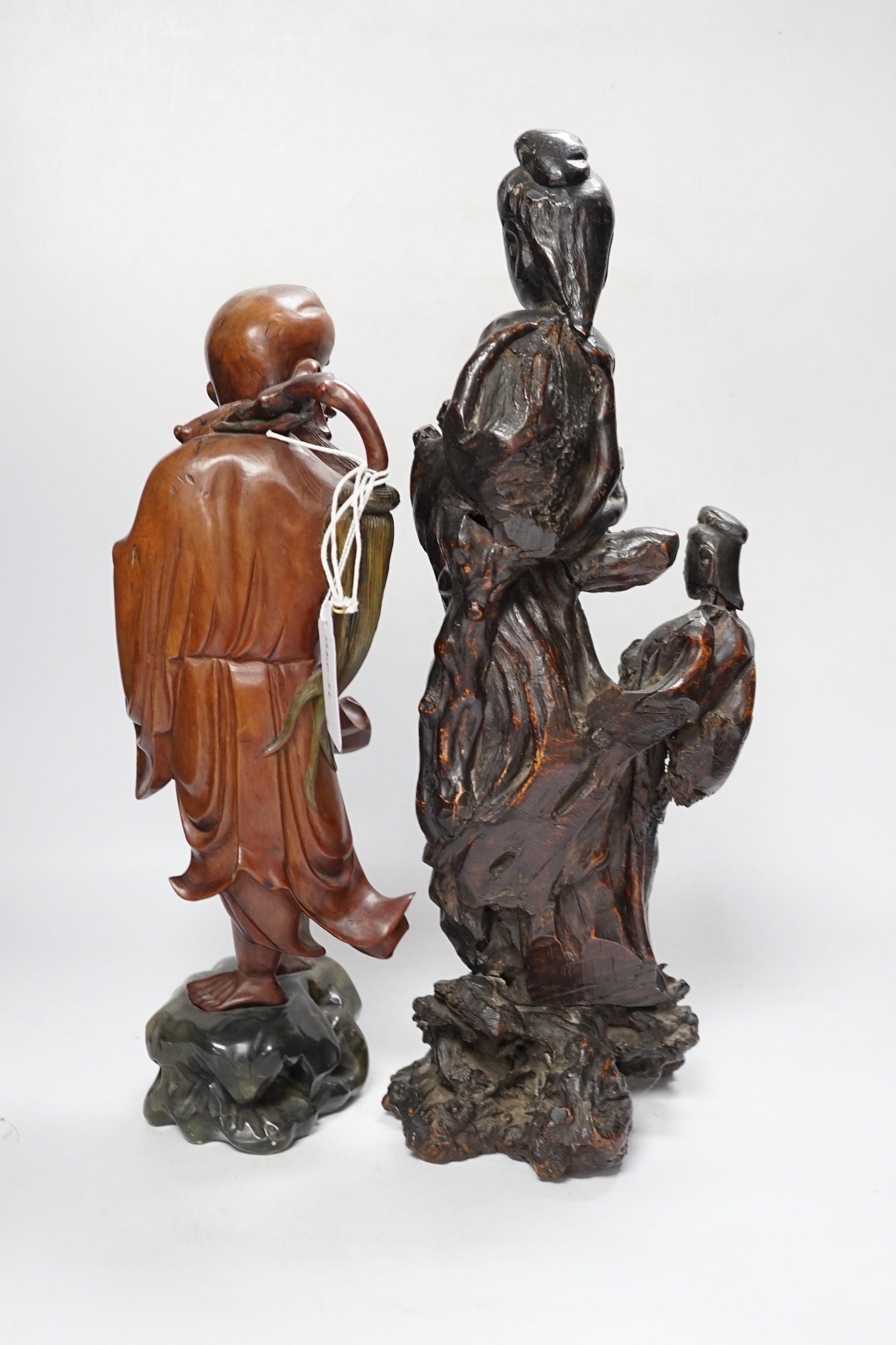 A Chinese root wood carving of two females, 42cm, and an early 20th century Chinese root carving of an immortal, on soapstone base, 36cm tall